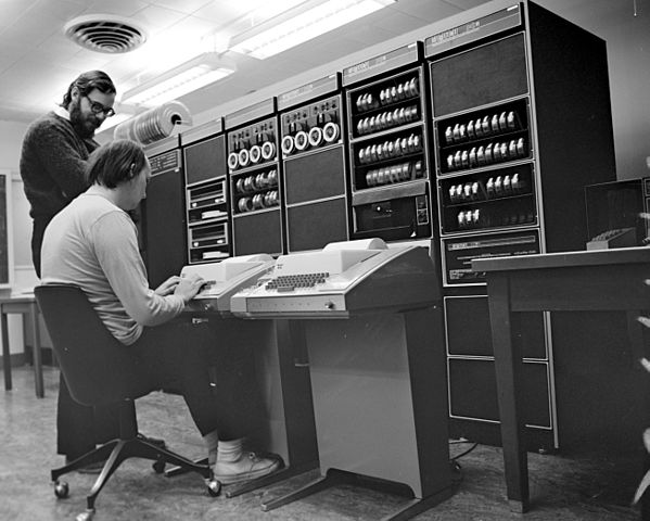 Ken Thompson (sitting) and Dennis Ritchie at PDP-11